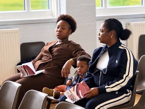 A mother and her two children during a service
