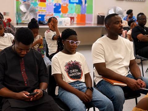 Young members seated together at a gathering