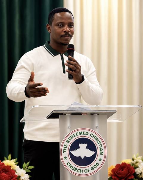 A member sharing from the pulpit